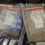 DNCD ocupa maleta abandonada con más de 28 libras de marihuana en el AILA